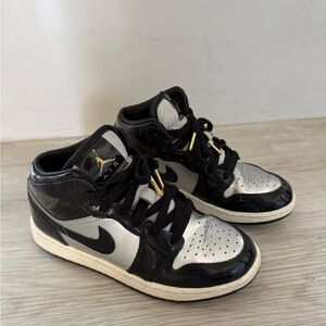 Nike Kids Black and Silver Sneakers with gold details. In great condition.
